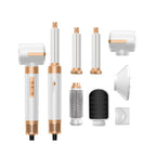 7-in-1 ionic hair dryer brush set in white and gold with interchangeable styling attachments including curling barrels, dryer nozzle and round brushes